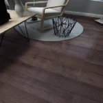 Close-up of dark wood plank flooring in a room