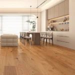 Modern kitchen and dining area with light wood flooring