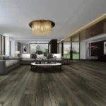 Modern living room with dark wood floors and marble table.