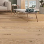 Modern living space featuring light wide-plank flooring