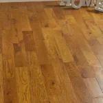 Oak engineered wood flooring planks in a room.