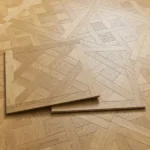 Two Versailles parquet wood floor tiles