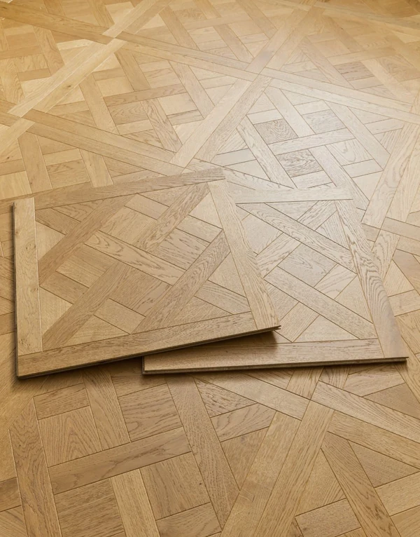 Two Versailles parquet wood floor tiles