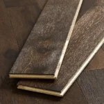 Two dark oak floor samples showing side grooves