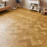 Versailles parquet wood flooring in a bright room.