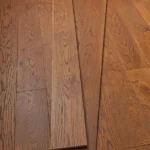 Warm oak hardwood flooring in a modern hallway.